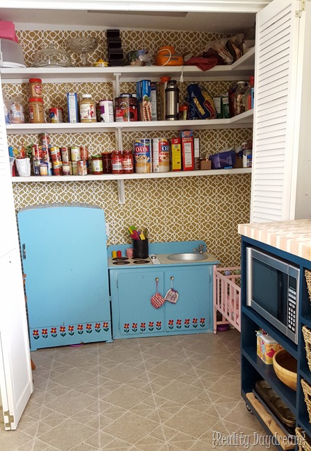 We put the play kitchen in the pantry where the old washer and dryer used to be.