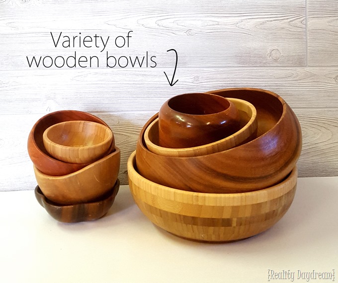 Use a variety of wooden bowls to make this vertical 'living wall' art installation planter! {Reality Daydream}