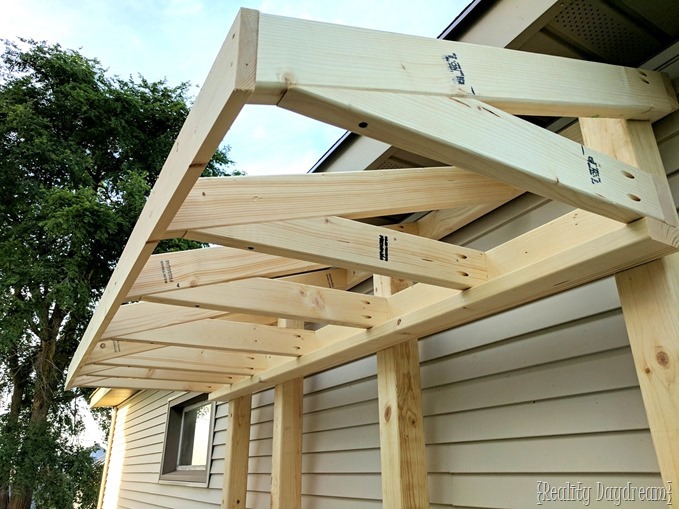 Making the roof or 'awning' for this potting bench garbage can enclosure {Reality Daydream}