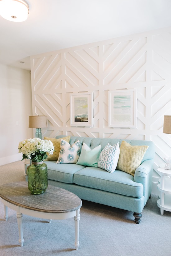 White texured accent walls with panels of wood to make geometric shapes - by Four Chairs Furniture