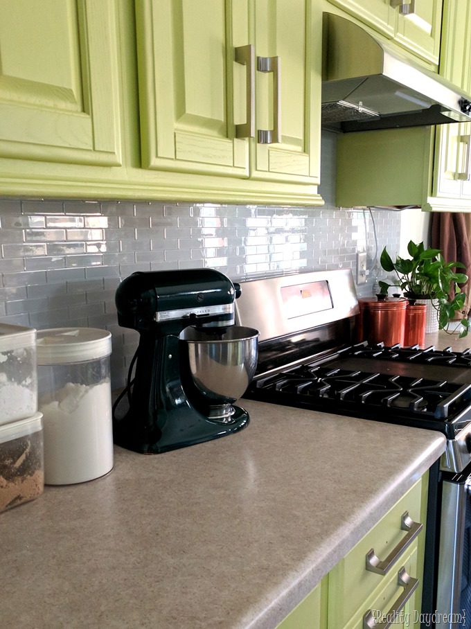 Chartreuse cabinets and installing a backsplash with white glass subway tile installation {Reality Daydream} #kitchen