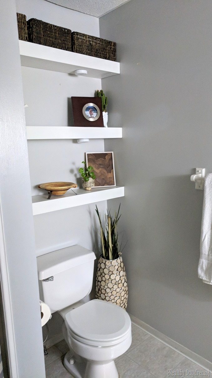 Floating shelf store over toilet