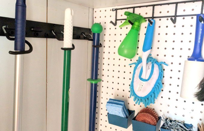 This Mop and Broom Holder Instantly Declutters Your Closet or Garage