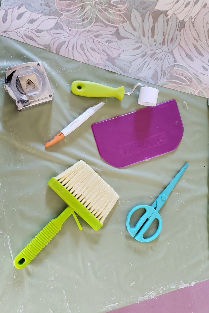 Tools and supplies for putting up wallpaper with wallpaper paste