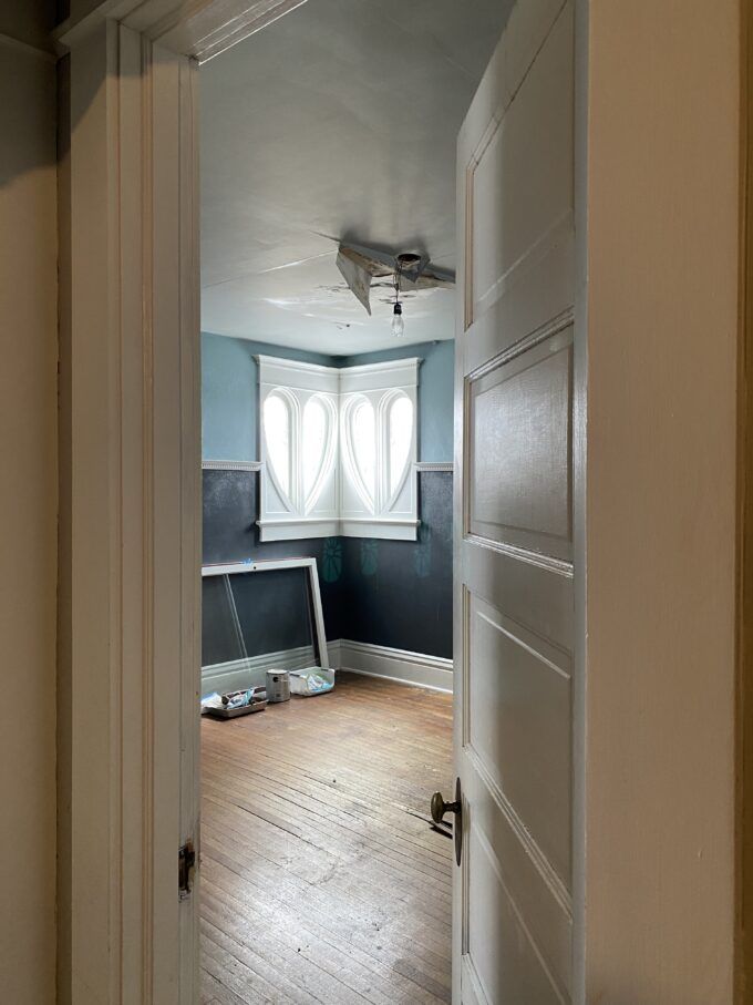 Bedroom with heart-shaped windows in The Newton Carmean House