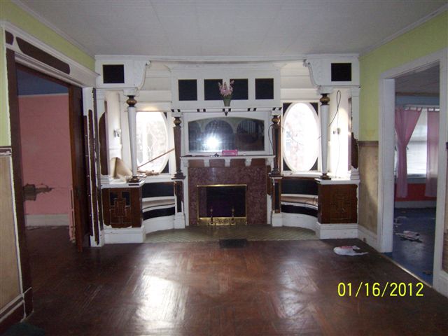 Old interior picture of the fireplace in the Newton Carmean House