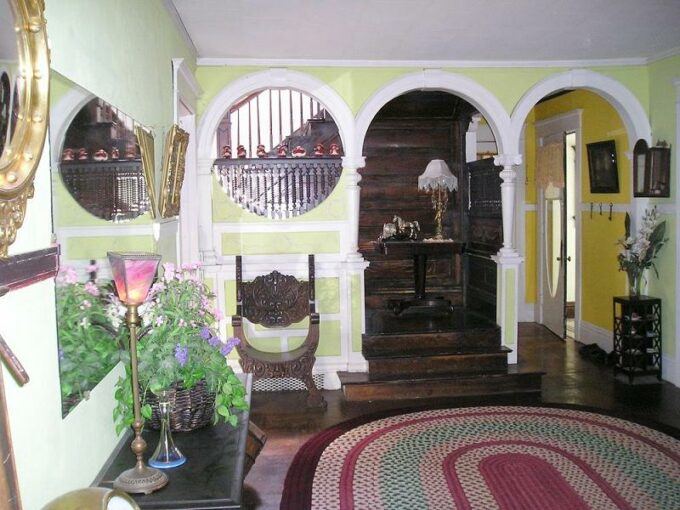 Old interior picture of the stairway in the newton carmean house