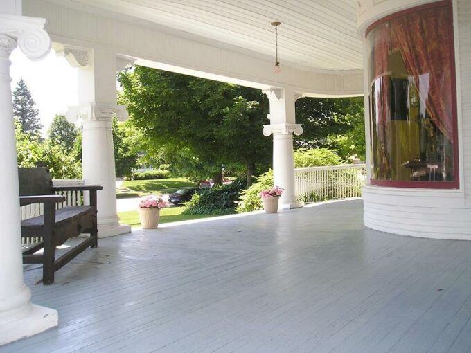 Photo of the Newton Carmean house front porch in the glory days